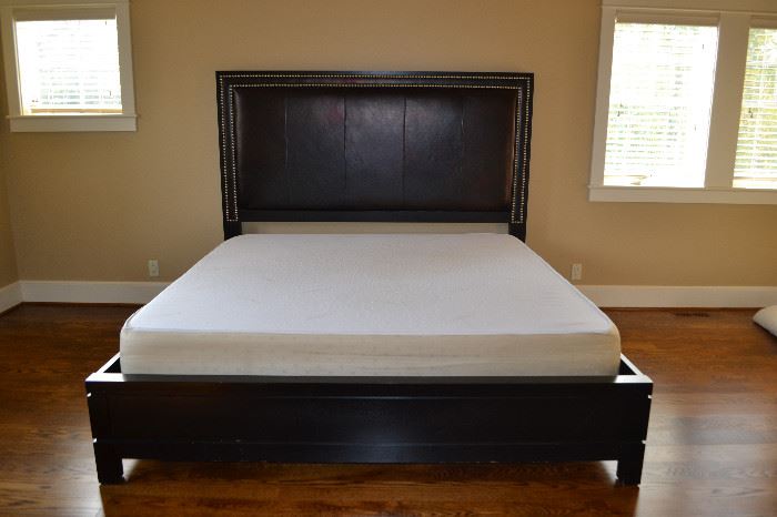 Lexington king sized platform bed with leather studded headboard and memory foam mattress.   64" high headboard