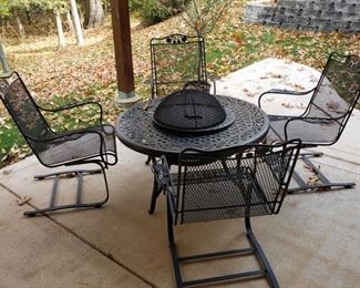 Log burning firepit and four armchairs