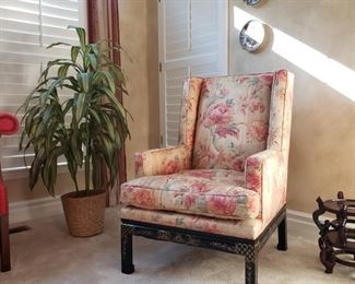 One of a pair of Chinese decorated upholstered wing back chairs