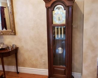 Howard Miller grandfather clock, left side glass has a crack otherwise its in great condition