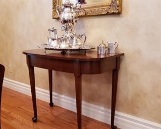 Mahogany side table with silverplate coffee and tea service and a hot water urn together with a tray