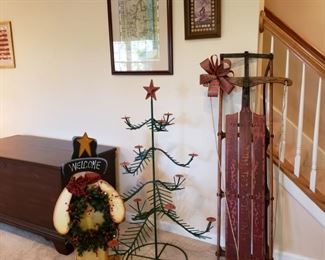 Antique sled, metal candle Christmas tree and a Welcome snowman