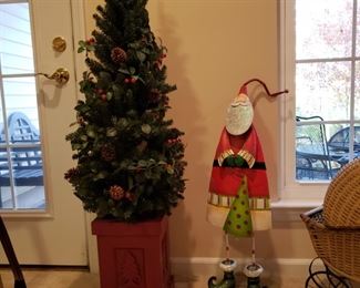 Pair of Christmas trees and a metal Santa 