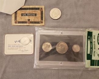 Money including a Franc with a note from when it was received