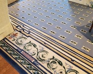 Three custom made rugs in blue and yellow tones, 2 measure appr. 15 feet by 27 feet 10 inches, the other appr. 10 feet by 25 feet 7 inches