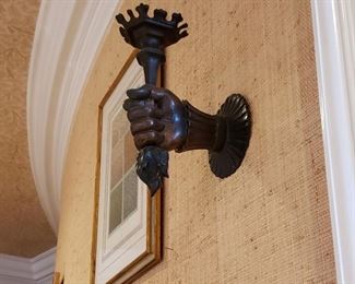 Pair of French bronze wall sconces of a hand holding a torch light