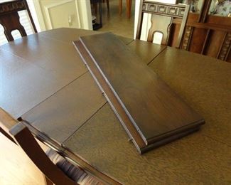 Dining Room Table has cover and 2 extra leaves