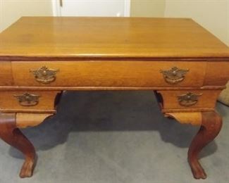 Antique oak desk with three drawers and claw feet