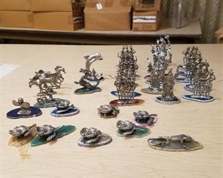 over 30 figurines - most are on polish slabs