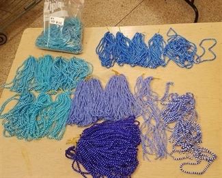 large lot of assorted blue beaded strands