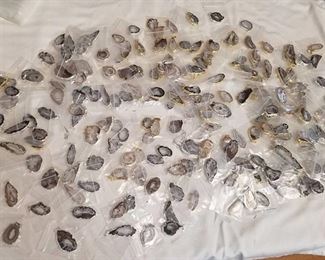 approximately 200 polished geode pendants