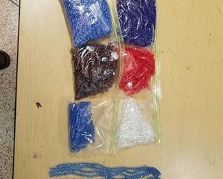 six bags of assorted stranded beads