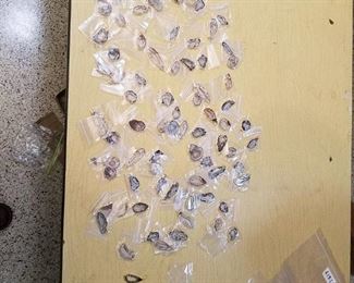 approximately 75 assorted polished Stone pendants