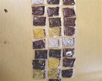 assorted jewelry beads - approximately 25 bags