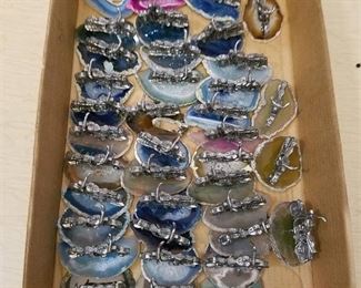 approximately 38 motorcycle figurines on polished geode slabs