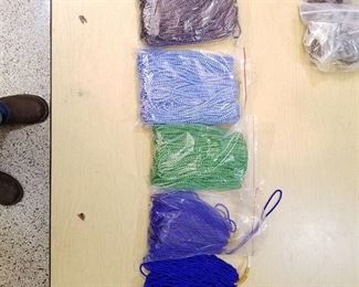 four bags of beaded strands -approximately 400 strands