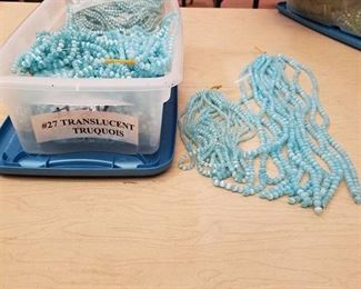 large lot of number 27 translucent turquoise beaded strands - 2 different sizes