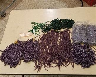 large lot of purple and green beaded strands