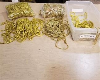 large lot of mustard colored stranded jewelry beads