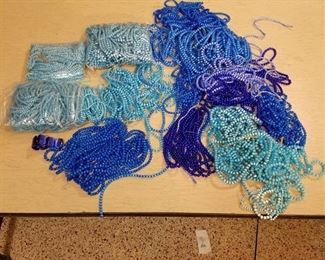 large lot of assorted blue colored beaded strands
