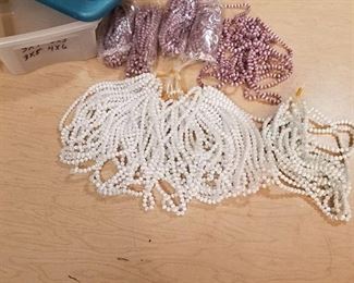 large lots of white and purple colored beaded strands