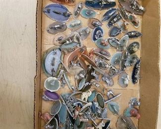 approximately 70 assorted figurines on polished stone slabs