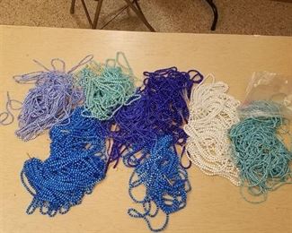large lot of assorted blue and white beaded strands