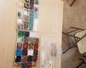 3 organizer containers with assorted jewelry beads