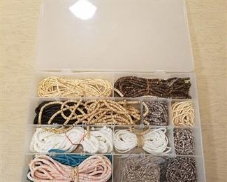 organizer container with assorted beaded strands