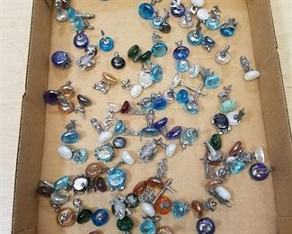 approximately 100 small figurines on glass half Moons