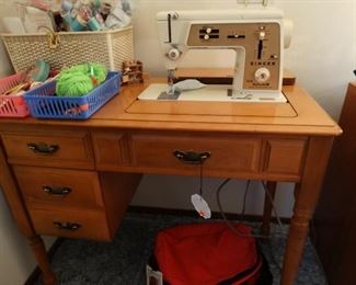Singer sewing machine in cabinet
