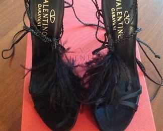 VALENTINO GARAVANI BLACK FEATHERS, SATIN, LEATHER LACE-UP OPEN-TOE SHOES: Size 36.5. Heel height: 4 ¼ inch satin heel. Long leather braided ties for versatile wear. Condition: Very good. Retail Value: $1,345. Price: $200.