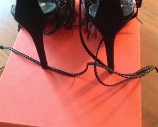VALENTINO GARAVANI BLACK FEATHERS, SATIN, LEATHER LACE-UP OPEN-TOE SHOES: Size 36.5. Heel height: 4 ¼ inch satin heel. Long leather braided ties for versatile wear. Condition: Very good. Retail Value: $1,345. Price: $200.