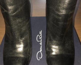 OSCAR DE LA RENTA BLACK LEATHER ANKLE BOOTS: Size 8 or 38.. Round-toe ankle boots with black matte and metal tone ombre block heels. Size 8 or 38. Heel Height: 3.5 inches. Condition: Good. Light scratches on toe, body and heels. Retail value: $890. Price: $200.