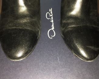 OSCAR DE LA RENTA BLACK LEATHER ANKLE BOOTS: Size 8 or 38.. Round-toe ankle boots with black matte and metal tone ombre block heels. Size 8 or 38. Heel Height: 3.5 inches. Condition: Good. Light scratches on toe, body and heels. Retail value: $890. Price: $200.