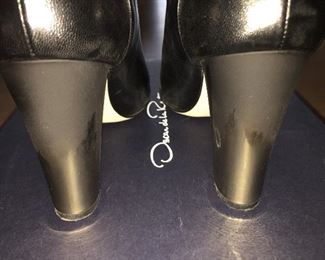 OSCAR DE LA RENTA BLACK LEATHER ANKLE BOOTS: Size 8 or 38.. Round-toe ankle boots with black matte and metal tone ombre block heels. Size 8 or 38. Heel Height: 3.5 inches. Condition: Good. Light scratches on toe, body and heels. Retail value: $890. Price: $200.