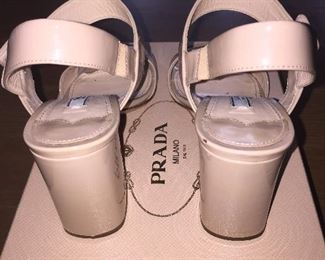 PRADA VERNICE CIPRIA NUDE BLOCK HEEL OPEN-TOE SANDAL: Size 37. Heel Height: 3 inches. From 2019 summer collection. Made in Italy. Condition: Scratches, scuffs, knicks and wear throughout. Retail Value: $600. Price: $100.
