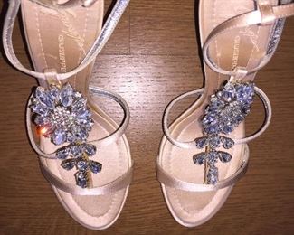 GIUSEPPE ZANOTTI SOFT PINK JEWEL EMBELLISHED SATIN STRAPPY EVENING SANDAL: Size 37.5 inches. Heel height: 4 inches. Made in Italy. Condition: Very good. Marks on both heels. Retail Value: $2,125. Price: $300.