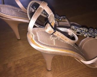 GIUSEPPE ZANOTTI SOFT PINK JEWEL EMBELLISHED SATIN STRAPPY EVENING SANDAL: Size 37.5 inches. Heel height: 4 inches. Made in Italy. Condition: Very good. Marks on both heels. Retail Value: $2,125. Price: $300.