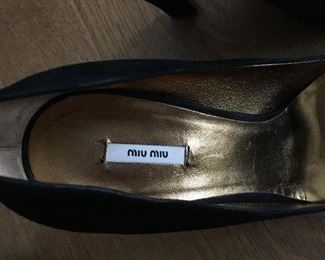 MIU MIU BLACK SUEDE PUMPS: Size: 37. Heel Height: 4.5 inches. Condition: Very good. Shoe runs big for Size 7 so pads were inserted in shoe bottom and around back. Price: $100.