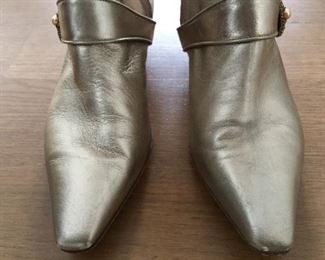 SALVATORE FERRAGAMO METALLIC GOLD-TONE LEATHER KNEE-HIGH BOOTS WITH RHINESTONE/PEARL EMBELLISHMENT: Size 7. Tonal strap accents at ankles. Covered heels and zipper closures at instep. Pink leather interior. Calf circumference: 13 inches. Shaft: 14.5 inches. Heel Height: 1.25 inches. Condition: Good. Faint scuffs and blemishes throughout. Price: $200.
