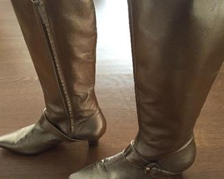 SALVATORE FERRAGAMO METALLIC GOLD-TONE LEATHER KNEE-HIGH BOOTS WITH RHINESTONE/PEARL EMBELLISHMENT: Size 7. Tonal strap accents at ankles. Covered heels and zipper closures at instep. Pink leather interior. Calf circumference: 13 inches. Shaft: 14.5 inches. Heel Height: 1.25 inches. Condition: Good. Faint scuffs and blemishes throughout. Price: $200.