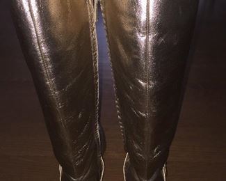 SALVATORE FERRAGAMO METALLIC GOLD-TONE LEATHER KNEE-HIGH BOOTS WITH RHINESTONE/PEARL EMBELLISHMENT: Size 7. Tonal strap accents at ankles. Covered heels and zipper closures at instep. Pink leather interior. Calf circumference: 13 inches. Shaft: 14.5 inches. Heel Height: 1.25 inches. Condition: Good. Faint scuffs and blemishes throughout. Price: $200.