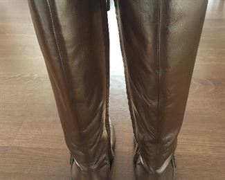 SALVATORE FERRAGAMO METALLIC GOLD-TONE LEATHER KNEE-HIGH BOOTS WITH RHINESTONE/PEARL EMBELLISHMENT: Size 7. Tonal strap accents at ankles. Covered heels and zipper closures at instep. Pink leather interior. Calf circumference: 13 inches. Shaft: 14.5 inches. Heel Height: 1.25 inches. Condition: Good. Faint scuffs and blemishes throughout. Price: $200.