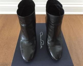 OSCAR DE LA RENTA BLACK LEATHER ANKLE BOOTS: Size 8 or 38.. Round-toe ankle boots with black matte and metal tone ombre block heels. Size 8 or 38. Heel Height: 3.5 inches. Condition: Good. Light scratches on toe, body and heels. Retail value: $890. Price: $200.