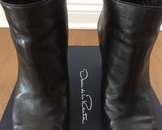 OSCAR DE LA RENTA BLACK LEATHER ANKLE BOOTS: Size 8 or 38.. Round-toe ankle boots with black matte and metal tone ombre block heels. Size 8 or 38. Heel Height: 3.5 inches. Condition: Good. Light scratches on toe, body and heels. Retail value: $890. Price: $200.