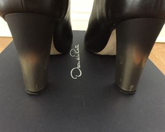 OSCAR DE LA RENTA BLACK LEATHER ANKLE BOOTS: Size 8 or 38.. Round-toe ankle boots with black matte and metal tone ombre block heels. Size 8 or 38. Heel Height: 3.5 inches. Condition: Good. Light scratches on toe, body and heels. Retail value: $890. Price: $200.
