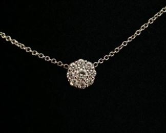 DIAMOND FLEURETTE 18 KT WHITE GOLD AND 1.64 CARAT DIAMOND NECKLACE: LOTS OF FIRE AND SPARKLE.
Signed appraisal report included. Gift Box Included.
One stamped and tested 18KT white gold lady's hand assembled three diamond cluster necklace with a shared prong set.
18KT white gold lobster clasp and bright polish finish.
Identified with markings of "18kt/750".
Condition: Excellent. Light scratches on metal.
Total Weight of Diamonds: 1.64 ct.
Total Weight of Three Diamond Cluster Necklace: 6.00 gm.
Three shared prong set round brilliant cut diamonds exact total weight of 3 stones = 0.52 ct.
Clarity: VS. Color: F. Cut: Excellent
Twenty-four shared prong set round brilliant cut diamonds exact total weight 24 stones = 1.12ct.
Clarity VS. Color: F-G. Cut: Excellent.
Price: $2,900