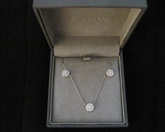 DIAMOND FLEURETTE 18 KT WHITE GOLD AND 1.64 CARAT DIAMOND NECKLACE: LOTS OF FIRE AND SPARKLE.
Signed appraisal report included. Gift Box Included.
One stamped and tested 18KT white gold lady's hand assembled three diamond cluster necklace with a shared prong set.
18KT white gold lobster clasp and bright polish finish.
Identified with markings of "18kt/750".
Condition: Excellent. Light scratches on metal.
Total Weight of Diamonds: 1.64 ct.
Total Weight of Three Diamond Cluster Necklace: 6.00 gm.
Three shared prong set round brilliant cut diamonds exact total weight of 3 stones = 0.52 ct.
Clarity: VS. Color: F. Cut: Excellent
Twenty-four shared prong set round brilliant cut diamonds exact total weight 24 stones = 1.12ct.
Clarity VS. Color: F-G. Cut: Excellent.
Price: $2,900