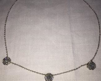 DIAMOND FLEURETTE 18 KT WHITE GOLD AND 1.64 CARAT DIAMOND NECKLACE: LOTS OF FIRE AND SPARKLE.
Signed appraisal report included. Gift Box Included.
One stamped and tested 18KT white gold lady's hand assembled three diamond cluster necklace with a shared prong set.
18KT white gold lobster clasp and bright polish finish.
Identified with markings of "18kt/750".
Condition: Excellent. Light scratches on metal.
Total Weight of Diamonds: 1.64 ct.
Total Weight of Three Diamond Cluster Necklace: 6.00 gm.
Three shared prong set round brilliant cut diamonds exact total weight of 3 stones = 0.52 ct.
Clarity: VS. Color: F. Cut: Excellent
Twenty-four shared prong set round brilliant cut diamonds exact total weight 24 stones = 1.12ct.
Clarity VS. Color: F-G. Cut: Excellent.
Price: $2,900